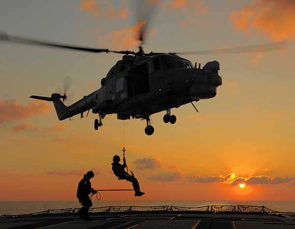Lynx Helicopter Practicing Winching Drills Over HMS Argyll's Flight Deck