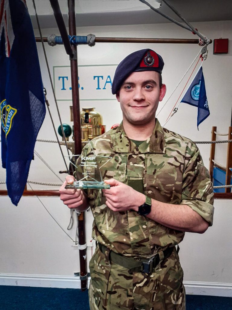 Acting Sergeant Dan Bradbury with his award from KMF