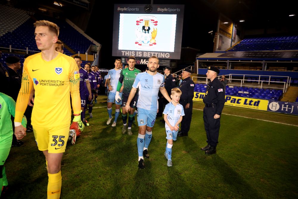 Coventry City walk out onto the pitch with HMS Forward Reservists