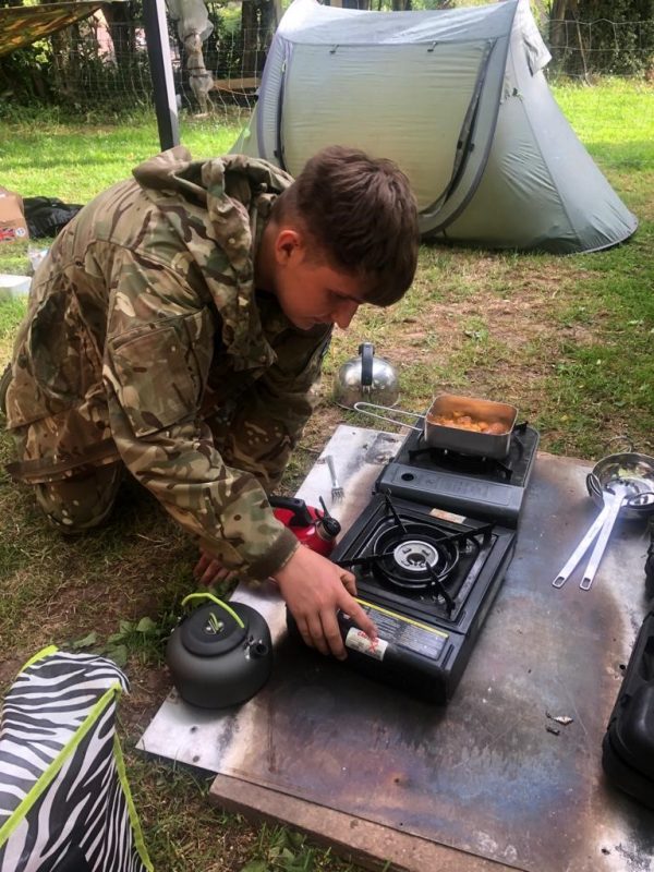 Hereford and Worcester Army Cadet Force cadet gets to grips with cooking his own ration pack