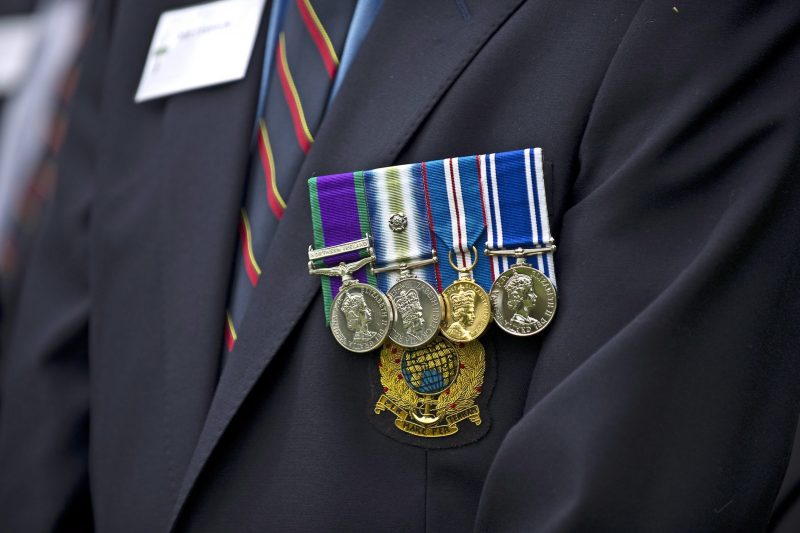 A veteran wearing his medals with pride