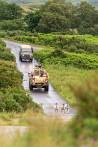 Jackal 2 vehicle and Land Rover on training camp