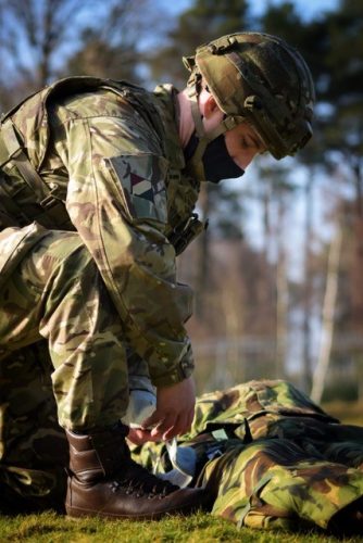 An Army Reservist practices his medical casualty drills as part of Exercise Saxon Shield.