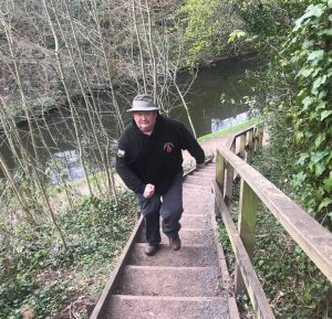 Major Curran climbing stairs on a walk