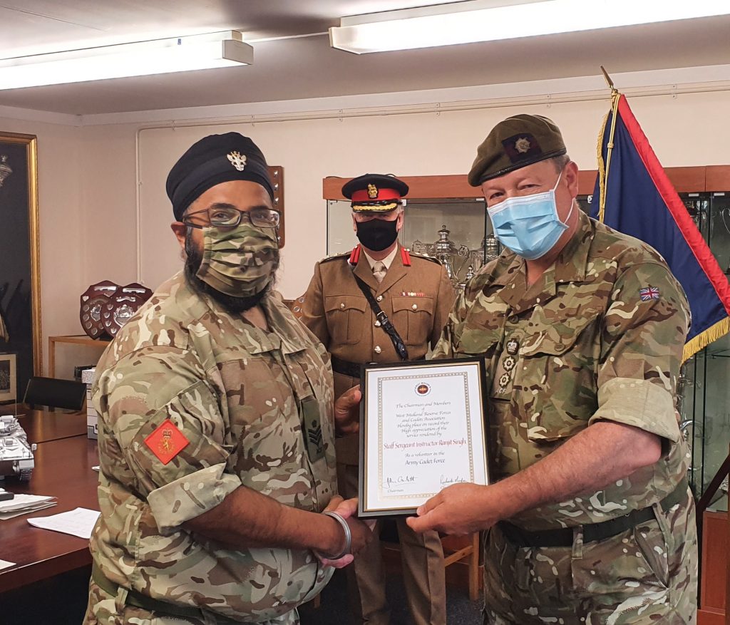 Staffordshire Army Cadet Force Volunteer SSI Singh receives his certificate