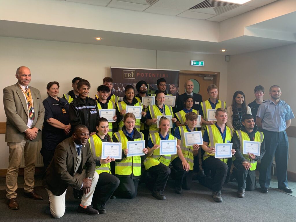 A group of students display their certificates from the West Midlands Lieutenancy after attending the DRIVE initiative community event