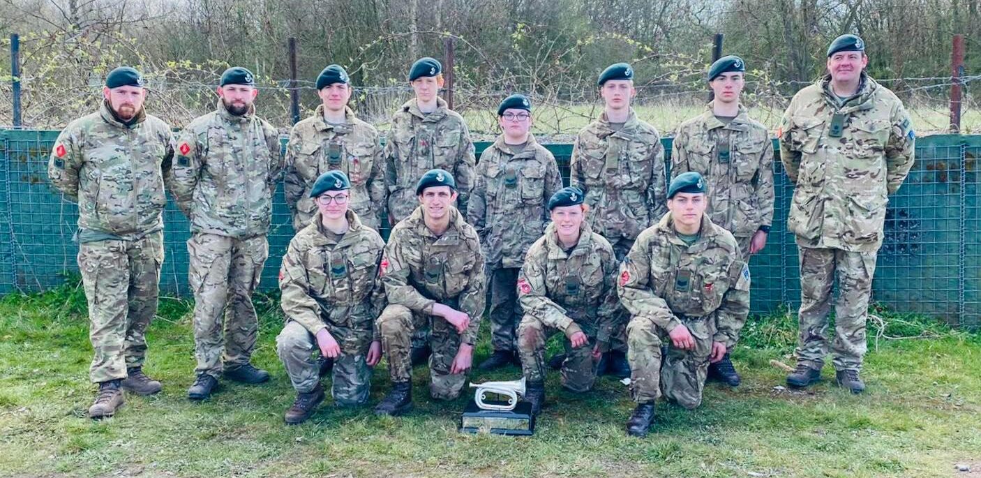 The Inkerman Company Team from Hereford and Worcester Army Cadet Force proudly pose in their uniforms with the winning trophy from the regional military skills competition.