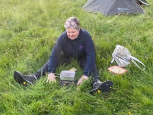 CI Whittall cooking on a camp stove