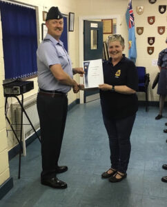 CI Whittall receiving a certificate.