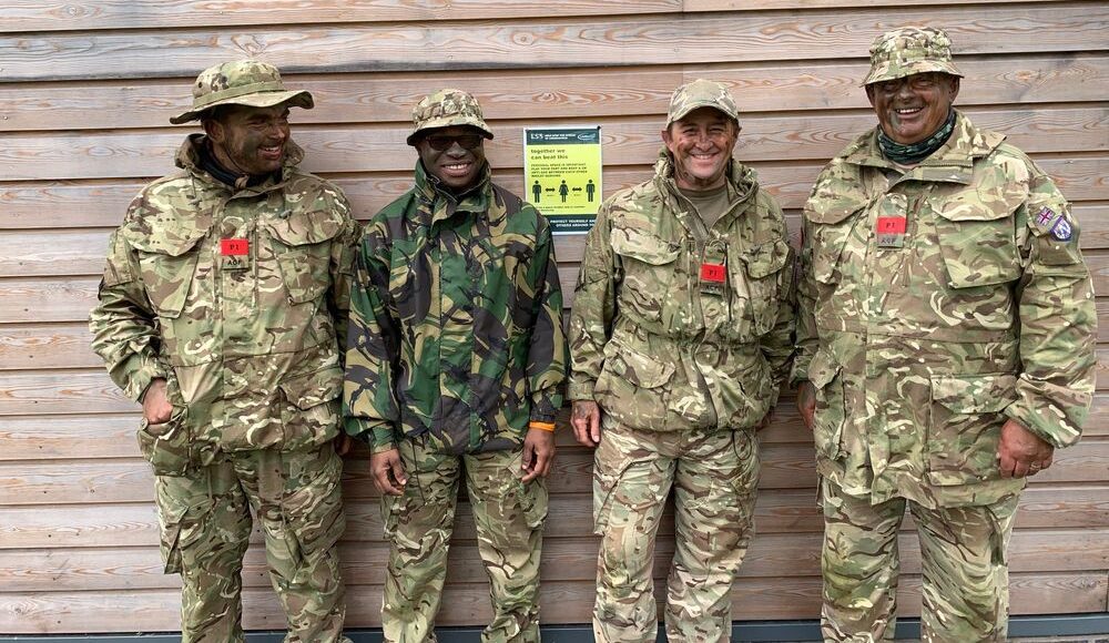 Second Lieutenant Dowley pictured with other volunteers wearing their Army Cadet Force uniforms and camouflage paint