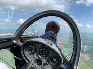 FS Baker flying in a glider.