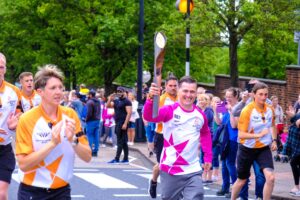 Sgt Sefton running with the baton.