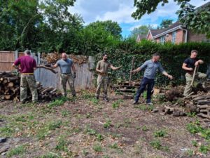 Reservists moving the wood.