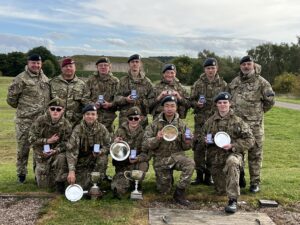 Cadets with medals and trophies.