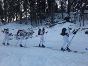 Skiing with backpacks.