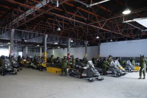 Vehicle equipment preparation in hangar.