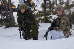 Soldiers from Canada and Britain on patrol.