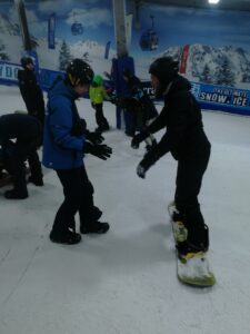 Learning to snowboard at the Snow Dome.