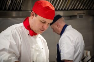 Army and RAF chefs in the kitchen.