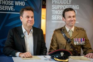 Justin Platt and Lt Col Charlie Whitting signing the Covenant.