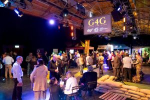 The main event space at Going for Gold 2025, where employers are chatting to other businesses and exploring stands and hardware manned by members of the Reserve Forces