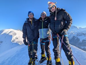 Three Reservists on snow covered mountain.