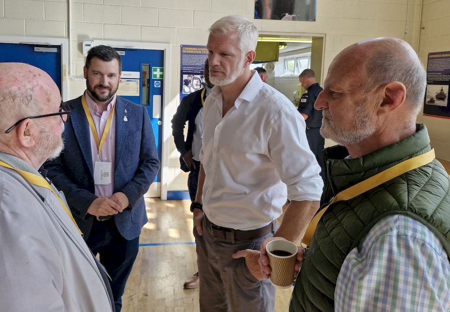 The then Minister for Veterans and People, Al Carns MP, chats to veterans at an informal networking breakfast event.